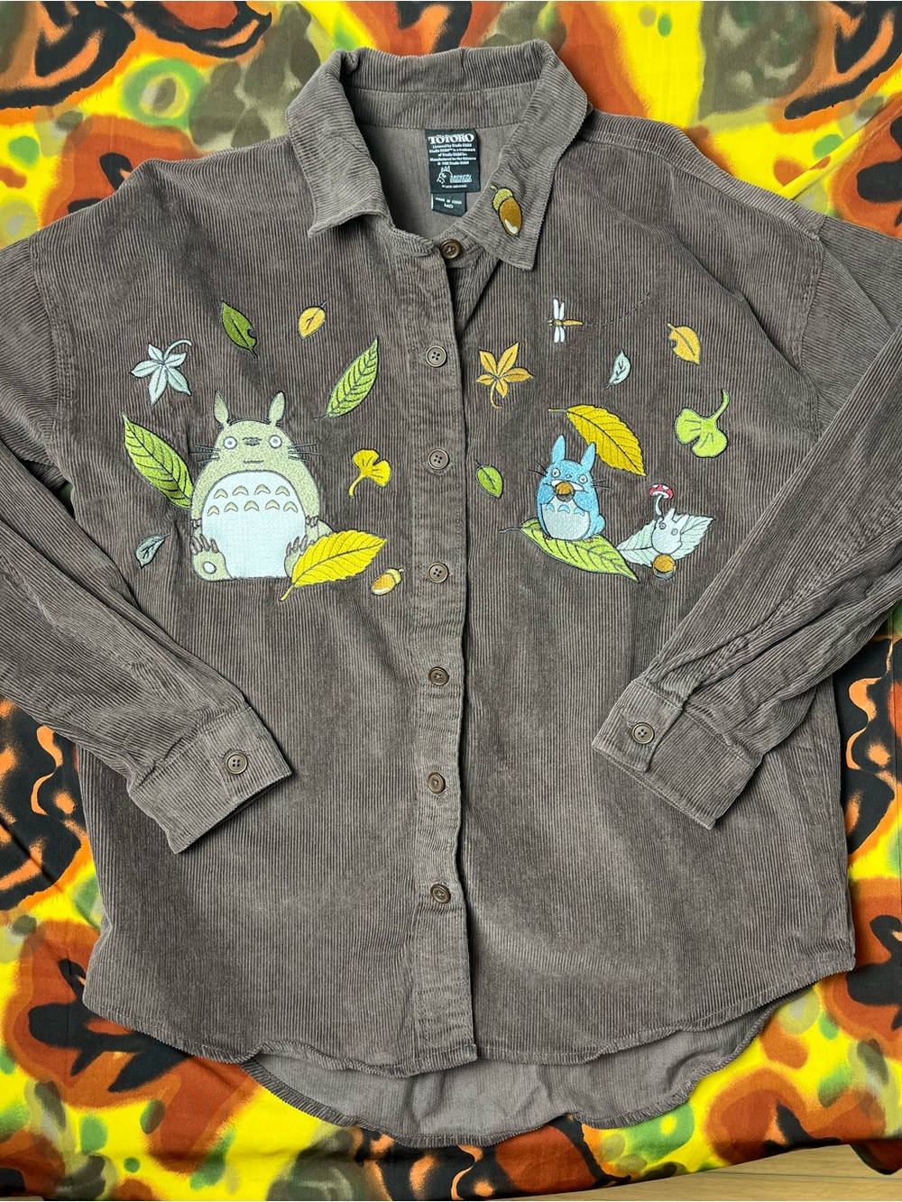 Brown corduroy button up shirt with Totoro and friends graphic featuring leaves